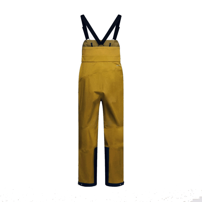 Pantaloni da montagna gialli con bretelle, abbigliamento outdoor tecnico e resistente.