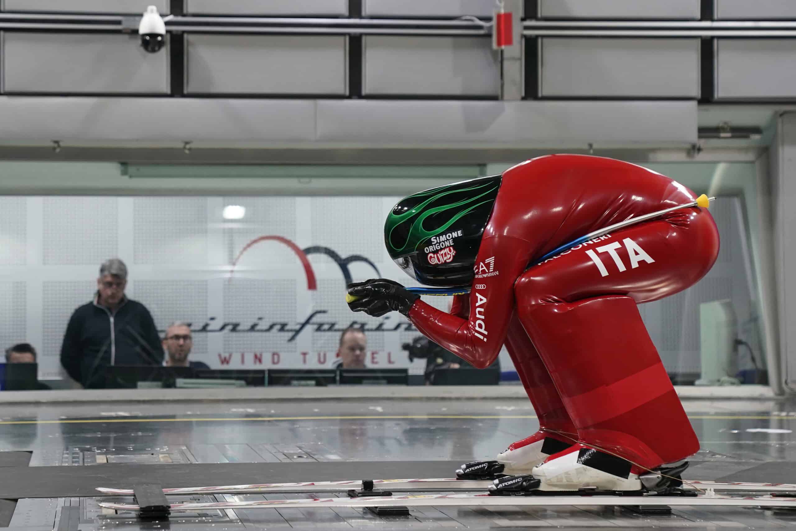Simone Origone in posizione aerodinamica nella galleria del vento Pininfarina Wind Tunnel durante i test della tuta da sci di velocità